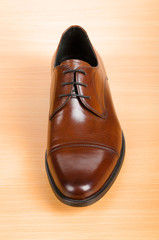Brown shoes on wooden table