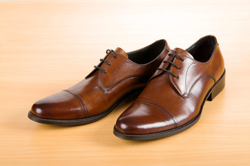 Brown shoes on wooden table