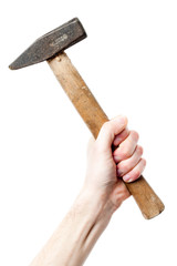 Hand holding a big hammer against a white background