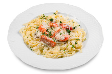 pasta with slice of salmon fish and parmesan, on white plate, is
