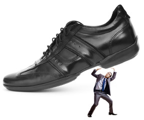 Woman domination concept with shoes and man