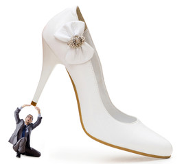 Woman domination concept with shoes and man
