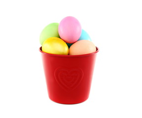 Colorful Easter eggs in a red bucket.