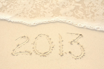 The Year 2013 Written in Sand on Beach