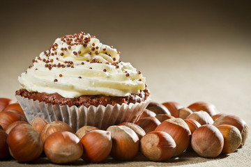 Closeup muffin with vanilla cream and lots of hazelnut