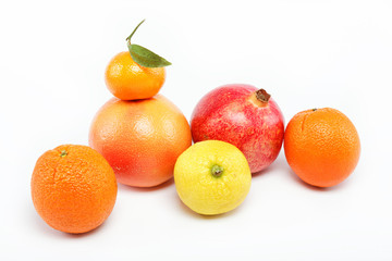 pomegranates and citrus fruits isolated on a white background.