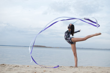 Young gymnast girl dance with ribbon