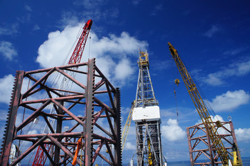 Jack Up Offshore Drilling Rig With Rig Cranes on Sunny Day in Th