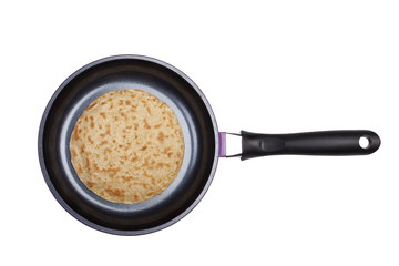 Pancake on a frying pan.