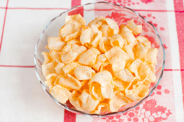 Tasty potato chips on a plate