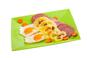 Green plateau with fried eggs