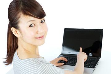 Beautiful asian woman using a laptop computer