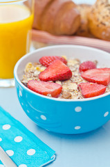Breakfast with fresh muesli and orange juice