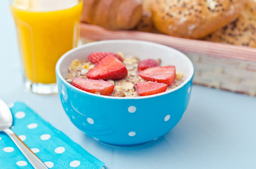 Breakfast with fresh muesli and orange juice