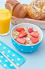Breakfast with fresh muesli and orange juice