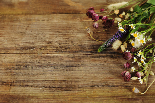 Blossom border on wood texture - summer floral background