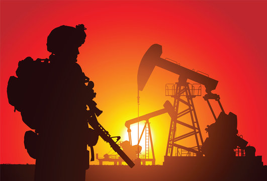 US soldier with oil rigs on the background