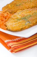 Spinach cutlet on white dish.