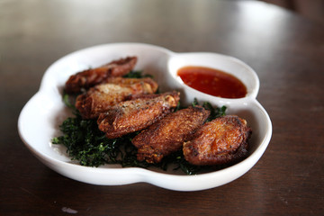 Fried chicken on wood background