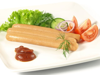 Frankfurters with ketchup and vegetables