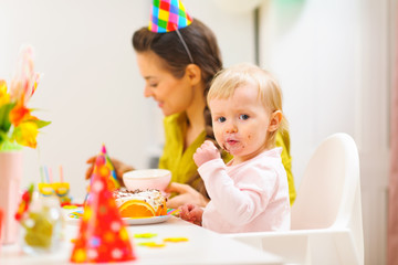 First birthday celebration party with mother and baby