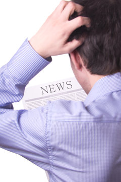 Man reading a newspaper with inscription NEWS