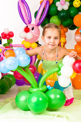 Fototapeta na wymiar Beautiful little girl in balloon forest