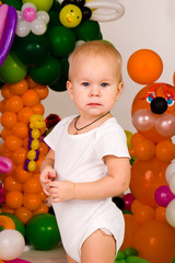 Fototapeta na wymiar Cute baby in balloon forest