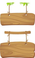 Wooden boards hanging on a cord on branch of a tree