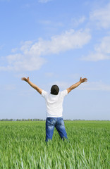Fototapeta premium man take energy from nature in the meadow