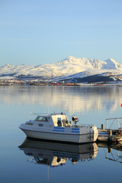 small boat mirroring with  Lofoten mountain