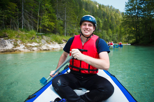White Water Rafting - Young Man In A Raft Boat