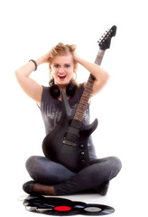 Fototapeta premium Woman with guitar listening to music isolated white background