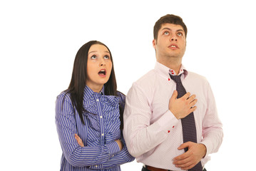 Amazed business people looking up