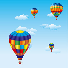 colorful balloons flying over clouds in sky