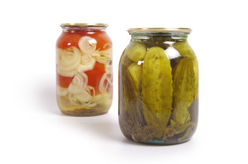 Pickled cucumber and tomato in glass