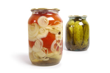 Pickled cucumber and tomato in glass