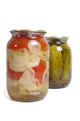 Pickled cucumber and tomato in glass