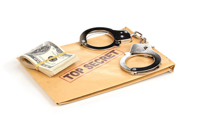 Dollar banknotes and handcuffs