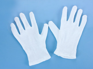 cloth gloves on blue background.