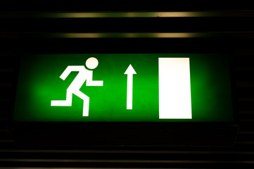 Closeup photo of an exit sign in the metro