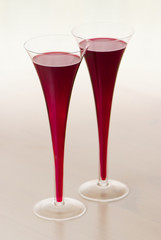 two glasses of red wine on the table