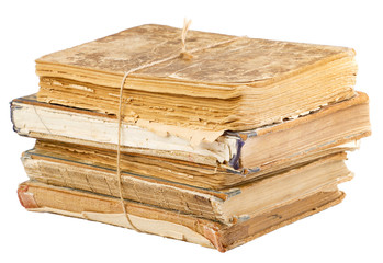 Stack of old books tied with rope isolated on white