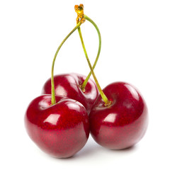 Red ripe cherries over white background