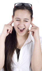 Fototapeta premium young woman suffers from noise pollution, covers his ears.
