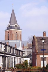 Obraz premium Houses and the tower of the st Petrus church in Woerden