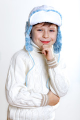 Kid in winter wear against white background