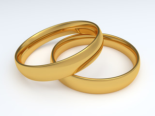 Two golden wedding rings isolated on white background