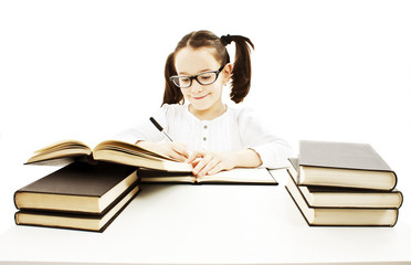 Little girl doing her homework. Isolated on white