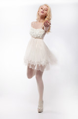 Romantic young pretty woman running in white dress © gromovataya